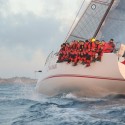 Shockwave Wins Line Honors as Most of Fleet Drifts On Glowing in the dawn sun, Shockwave presses on toward the St. David's Lighthouse finish line. (Talbot Wilson/PPL)