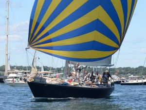 Flying the Naval Academy's distinctive colors, Swift starts the light-air 2014 race. (Talbot Wilson)