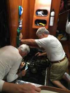 Frank and the skipper working on the engine.