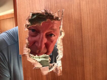 Jim Binch and damaged door on Killua