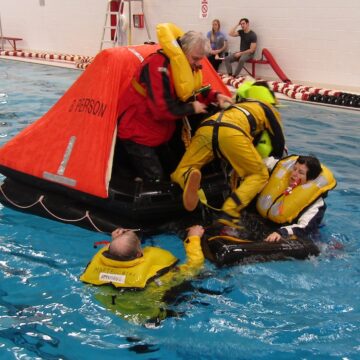 Sunflower crew boarding life raft